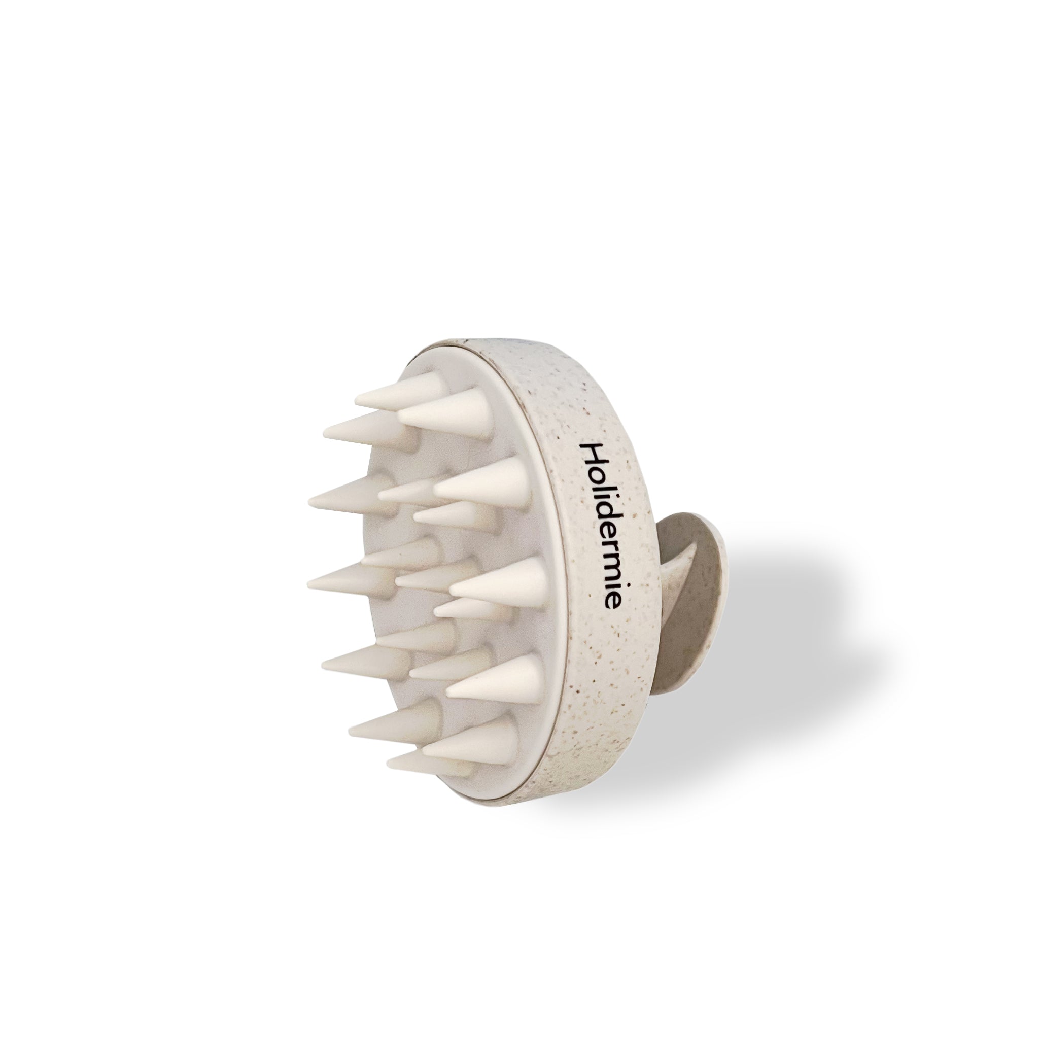 Brosse stimulante cuir chevelu pour favoriser la pousse et renforcer les racines
